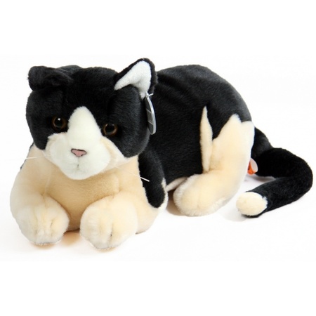 Plush black and offwhite cat lying